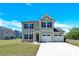 Charming two-story home features a two-car garage, well-maintained lawn, and welcoming curb appeal at 207 Aspire Cir # 46, Wingate, NC 28174