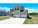 Charming two-story home features a two-car garage, well-maintained lawn, and welcoming curb appeal at 207 Aspire Cir # 46, Wingate, NC 28174