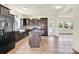 Modern kitchen boasts dark cabinets, stainless steel appliances, a central island, and hardwood floors at 207 Aspire Cir # 46, Wingate, NC 28174