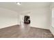 Open concept living area leading to a modern kitchen with dark wood cabinetry at 207 Aspire Cir # 46, Wingate, NC 28174