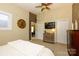 Spacious bedroom with a brick accent wall, double closets, ceiling fan, and carpet flooring at 217 W 8Th St, Charlotte, NC 28202
