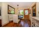 Warm dining area features hardwood floors, pendant lights, and a view of the outdoors at 217 W 8Th St, Charlotte, NC 28202