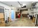 Spacious garage with storage shelves, work bench, and an access door at 217 W 8Th St, Charlotte, NC 28202