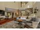 Open concept living room with high ceilings, modern staircase, and a stylish area rug at 217 W 8Th St, Charlotte, NC 28202