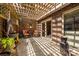 Charming outdoor patio with a fountain, stone accents, and a unique pergola offering dappled sunlight at 217 W 8Th St, Charlotte, NC 28202