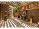 Quiet patio with water feature, brick walls, and a shady trellis overhead at 217 W 8Th St, Charlotte, NC 28202