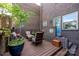Private brick patio featuring outdoor seating and a blue door at 217 W 8Th St, Charlotte, NC 28202
