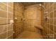 Luxurious tiled shower stall with a built-in bench and dual shower heads at 217 W 8Th St, Charlotte, NC 28202