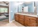 Bright bathroom featuring double sink vanity, granite countertop, mirror and neutral tile floor at 2202 Chickasaw Loop, Rock Hill, SC 29732