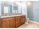Bathroom featuring double vanity, cabinets, and blue walls at 2202 Chickasaw Loop, Rock Hill, SC 29732