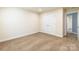 Neutral carpeted bedroom with closet, and door to hall. Recessed lighting and neutral walls at 2202 Chickasaw Loop, Rock Hill, SC 29732