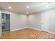 A modern bedroom offers hardwood floors and recessed lighting at 2202 Chickasaw Loop, Rock Hill, SC 29732