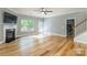 Open living space featuring hardwood floors, fireplace and entry to an outside deck and a staircase at 2202 Chickasaw Loop, Rock Hill, SC 29732