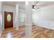Bright and airy living room featuring beautiful hardwood floors, classic columns, and elegant trim work at 2202 Chickasaw Loop, Rock Hill, SC 29732