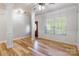 Spacious room with hardwood floors, natural light from the windows, and classic architectural columns at 2202 Chickasaw Loop, Rock Hill, SC 29732
