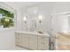 Clean bathroom with a large mirror, white marble counters, and modern fixtures at 2411 Ainsdale Rd, Charlotte, NC 28226