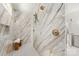 Contemporary bathroom features elegant marble tiling, double shower heads and custom glass work at 2411 Ainsdale Rd, Charlotte, NC 28226