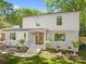 Elegant two-story home with brick accents, a well-manicured lawn, and a welcoming front entrance at 2411 Ainsdale Rd, Charlotte, NC 28226