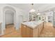 Spacious kitchen featuring an island with seating, marble countertops, and open layout at 2411 Ainsdale Rd, Charlotte, NC 28226