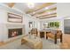 Inviting living room with hardwood floors, fireplace, and a sliding glass door leading to an outdoor space at 2411 Ainsdale Rd, Charlotte, NC 28226