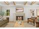 Cozy living room showcasing a stone fireplace, hardwood floors, and comfortable seating with natural lighting at 2411 Ainsdale Rd, Charlotte, NC 28226