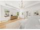 Spacious and bright main bedroom with hardwood floors and a view to the outside patio at 2411 Ainsdale Rd, Charlotte, NC 28226