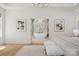 Bright main bedroom featuring a spacious layout with a marble-walled bathroom and chandelier at 2411 Ainsdale Rd, Charlotte, NC 28226