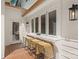 Outdoor deck area features a bar counter with seating and a view into the kitchen at 2411 Ainsdale Rd, Charlotte, NC 28226