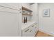 Pantry boasts white cabinets, quartz countertops, and stylish hardware at 2411 Ainsdale Rd, Charlotte, NC 28226