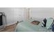 Bedroom features a wooden bed frame, hardwood floors, a window and closet doors at 247 Timberland Loop, Mooresville, NC 28115