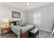 Bedroom features a wooden bed frame, hardwood floors, a window and workout machine at 247 Timberland Loop, Mooresville, NC 28115