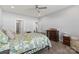 Bedroom with hardwood floors, ceiling fan, dresser, and multiple doorways at 247 Timberland Loop, Mooresville, NC 28115