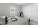 Bedroom features a wooden bed frame, hardwood floors, a window and workout machine at 247 Timberland Loop, Mooresville, NC 28115