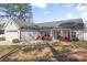 Charming single-story home with a well-maintained yard, white siding, and a classic front porch at 247 Timberland Loop, Mooresville, NC 28115