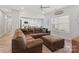 Spacious living room with a large sectional sofa, light gray walls and wood-style flooring at 247 Timberland Loop, Mooresville, NC 28115