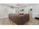 Comfortable living room with brown sectional sofa and stylish decor, featuring wood-style flooring at 247 Timberland Loop, Mooresville, NC 28115