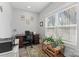 Bright home office with natural light, desk, plants, and a printer at 247 Timberland Loop, Mooresville, NC 28115