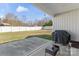 Cozy patio with grill and outdoor seating, perfect for entertaining or relaxing with a view of the backyard at 247 Timberland Loop, Mooresville, NC 28115