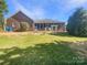 Expansive backyard with a screened porch, ideal for outdoor entertaining and relaxation at 249 Arrowood Ave, Lancaster, SC 29720