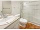 Well-lit bathroom featuring a glass shower stall and neutral-toned walls at 249 Arrowood Ave, Lancaster, SC 29720