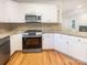 Kitchen featuring white cabinets and stainless steel appliances at 249 Arrowood Ave, Lancaster, SC 29720