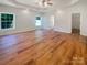 Spacious main bedroom featuring wood floors, two windows, and a ceiling fan at 249 Arrowood Ave, Lancaster, SC 29720