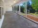 Bright screened porch with an expansive view of the landscaped backyard at 249 Arrowood Ave, Lancaster, SC 29720