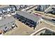 Aerial view of townhomes with dark roofs, small balconies, and a shared outdoor space at 2520 Ensemble Ct, Charlotte, NC 28262