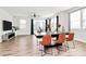 Open-concept dining area with hardwood floors and large windows, perfect for entertaining guests at 2520 Ensemble Ct, Charlotte, NC 28262