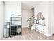 Welcoming hallway with modern decor, console table, and stairway leading to the upper level at 2520 Ensemble Ct, Charlotte, NC 28262