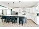 Spacious kitchen with stainless steel appliances, island with bar seating, and pendant lighting at 2520 Ensemble Ct, Charlotte, NC 28262