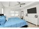 Cozy main bedroom with soft natural light, dresser, and mounted TV at 2520 Ensemble Ct, Charlotte, NC 28262