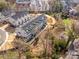Aerial view of multi-story townhomes with top-floor patios, landscaping, and ample parking at 2558 Deacon Ave, Charlotte, NC 28204