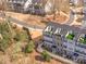 An aerial shot highlights the townhome community with rooftop terraces and beautifully maintained landscaping at 2558 Deacon Ave, Charlotte, NC 28204